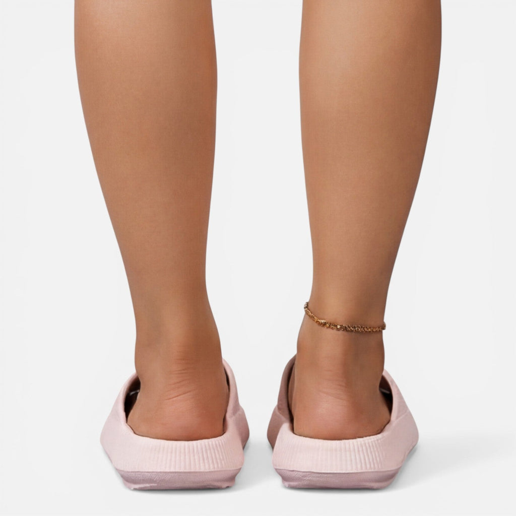 Women’s slide sandals in light pink with open toe and cushioned wedge sole