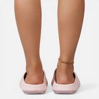 Women’s slide sandals in light pink with open toe and cushioned wedge sole