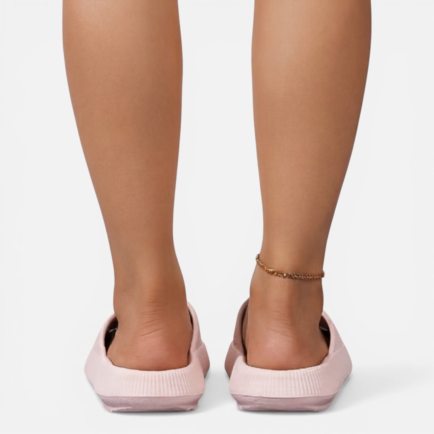Women’s slide sandals in light pink with open toe and cushioned wedge sole