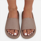 Women’s slide sandals in taupe with ribbed upper and gold chain ankle strap