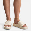 Women’s slide sandals in beige with ribbed upper and gold chain ankle strap
