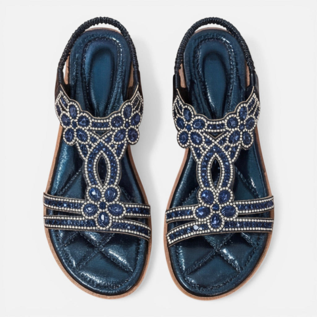Pair of blue embellished slide sandals with jeweled floral designs and beaded trim
