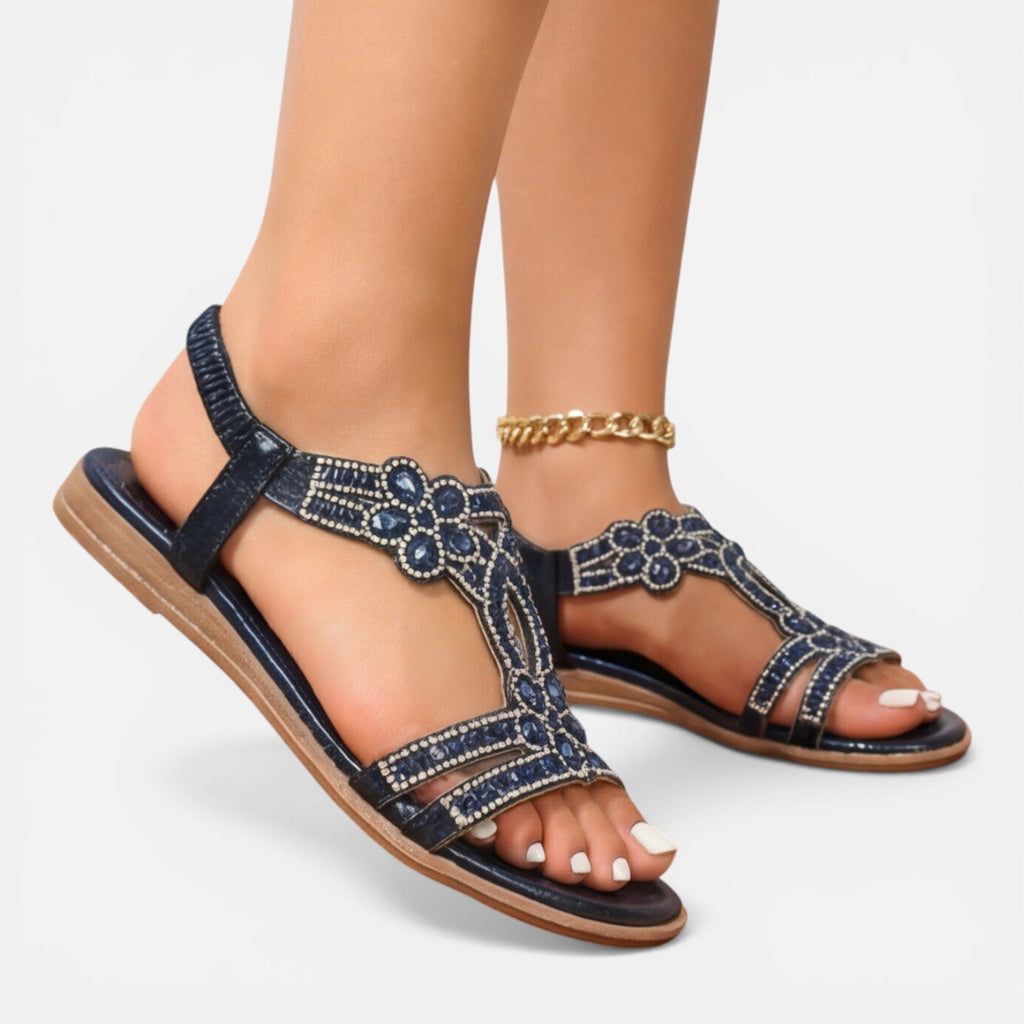 Blue jeweled T-strap wedge sandals with ankle strap and gold chain accent