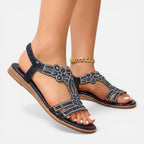 Blue jeweled T-strap wedge sandals with ankle strap and gold chain accent