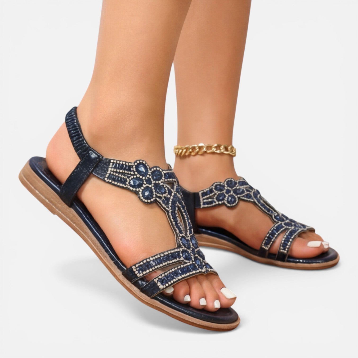 Blue jeweled T-strap wedge sandals with ankle strap and gold chain accent