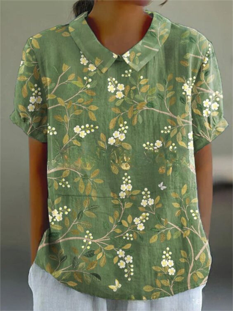 Floral print short-sleeve blouse in green with buttoned V-neck collar