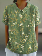 Floral print short-sleeve blouse in green with buttoned V-neck collar