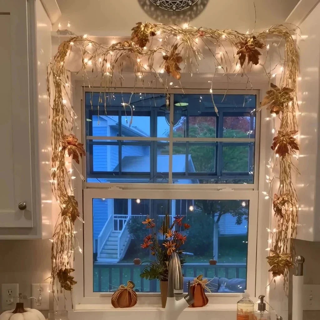 leaf garland border with warm fairy lights framing a double window