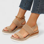 Beige two-strap platform sandals with open toe and textured fabric straps