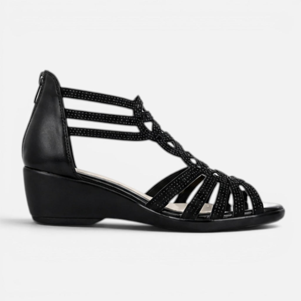 Women’s black wedge sandals side view with cutout crisscross straps