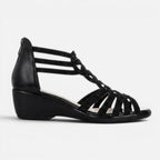 Women’s black wedge sandals side view with cutout crisscross straps