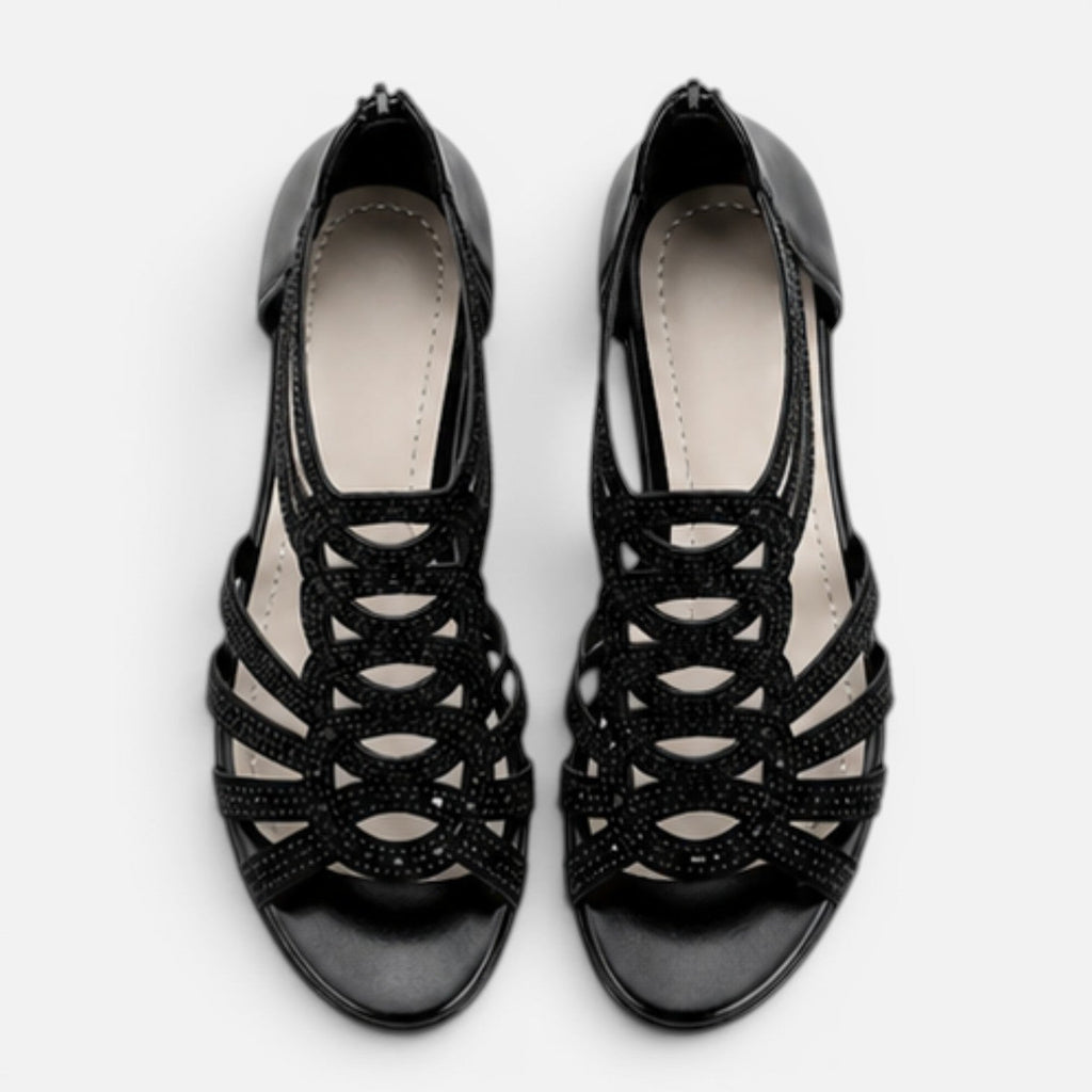 Women’s black sandals top view with open toe and lace-like cutout straps