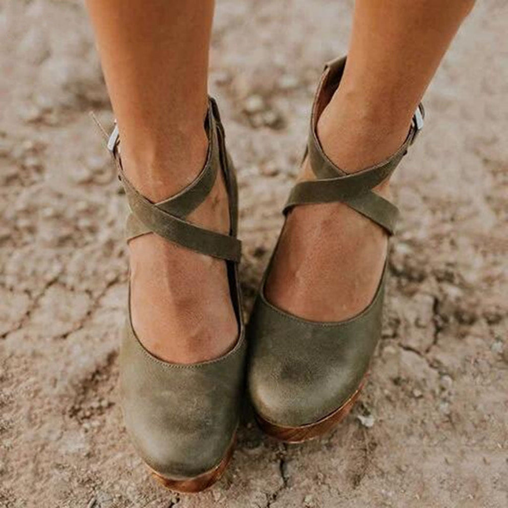 Dark green cross-strap Mary Jane platform heels with ankle buckle