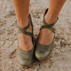 Dark green cross-strap Mary Jane platform heels with ankle buckle