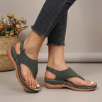 Green thong sandals with adjustable strap and arch support, open-toe sandal