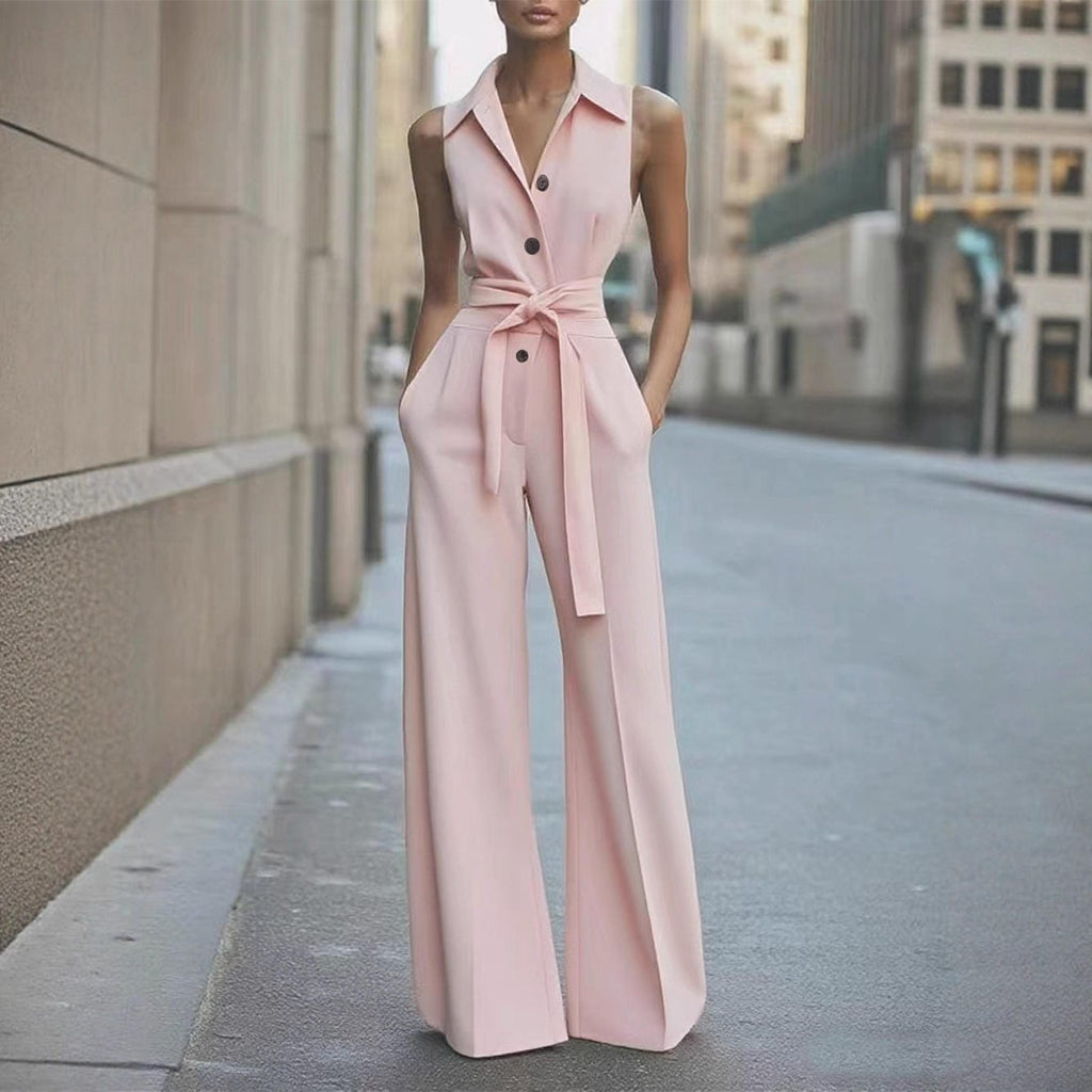 Pink sleeveless wide-leg jumpsuit with lapel collar, button front, waist tie belt