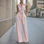 Pink sleeveless wide-leg jumpsuit with lapel collar, button front, waist tie belt