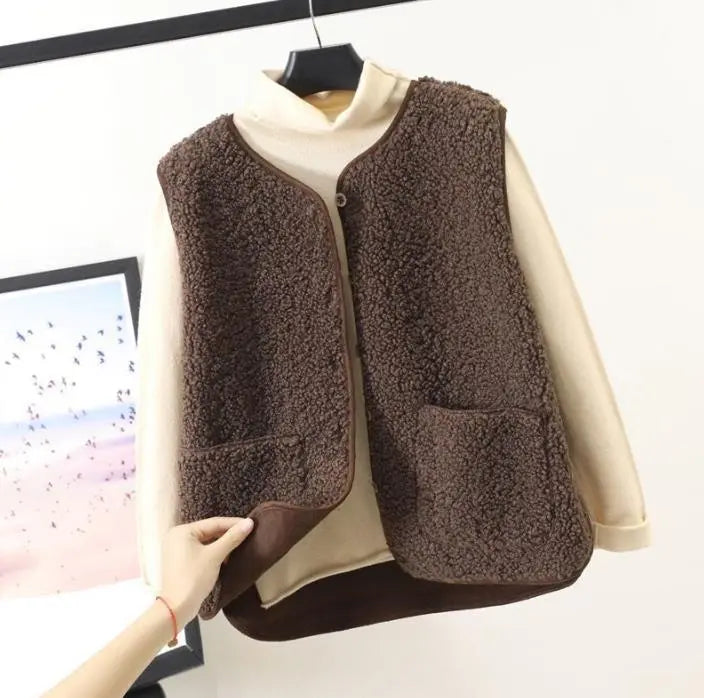 Dark brown fleece vest with button front and patch pocket on chest