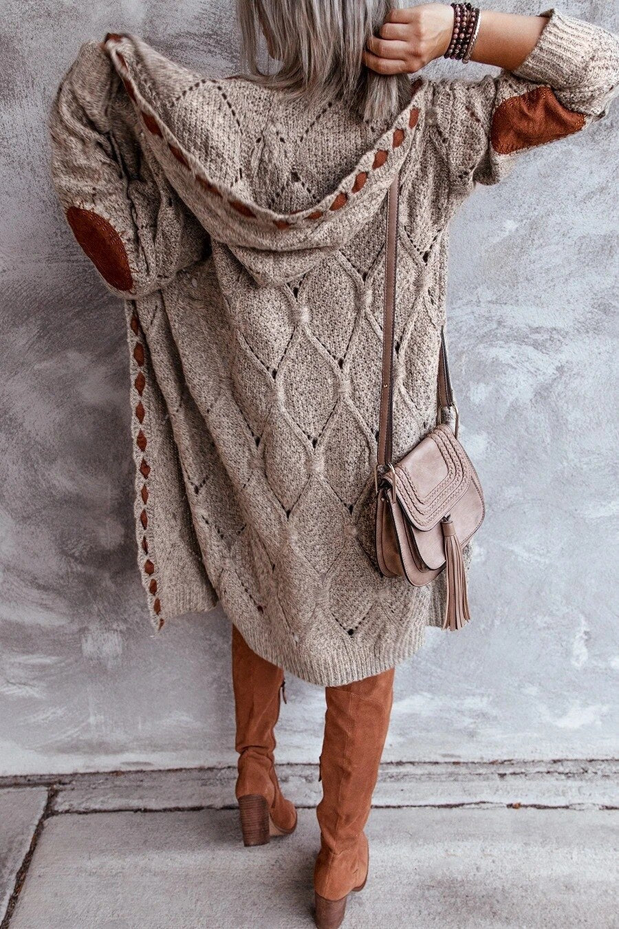 Long hooded knit cardigan with cutout trim, beige textured knit with tassel sleeves