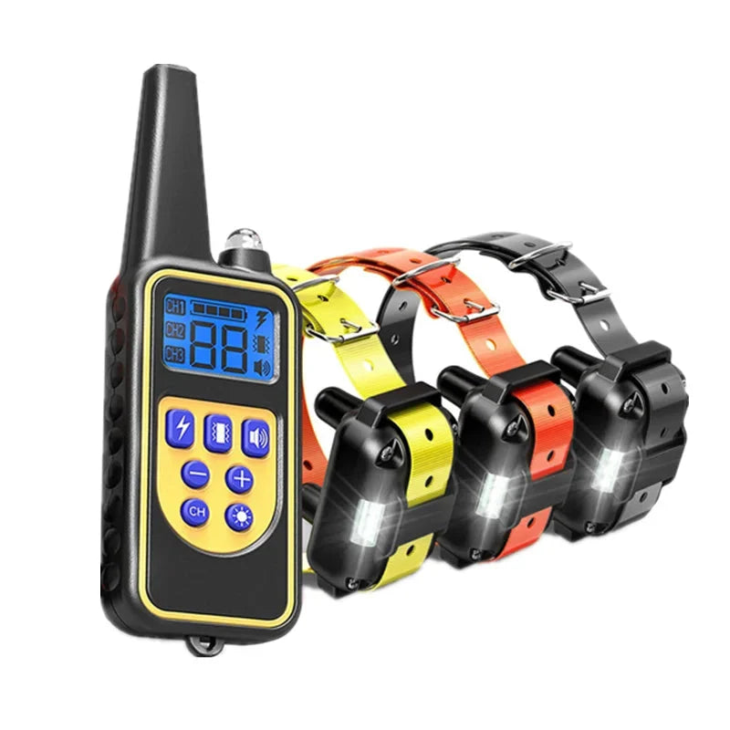 Electric dog training collar set with black remote and yellow, orange, and black receiver collars