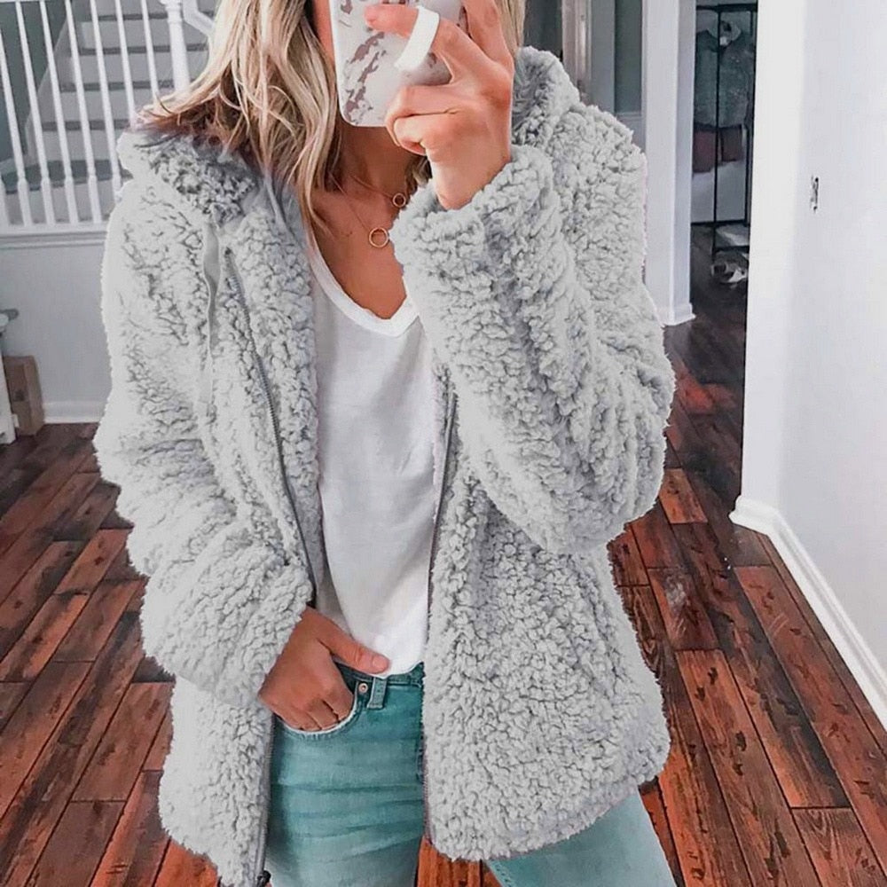Light gray hooded teddy fleece vest with long sleeves and relaxed fit