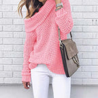 Women’s off-shoulder knitted sweater, pink, long sleeves with chunky knit texture.