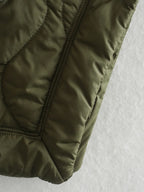 Olive green quilted bodywarmer, ribbed hem and stitched panels detail