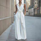 White sleeveless wide-leg jumpsuit with lapel collar, button front, waist tie belt