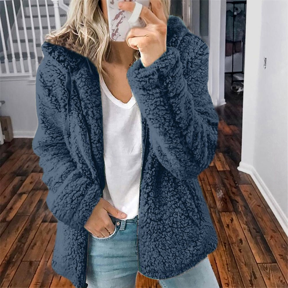 Navy hooded teddy fleece vest with long sleeves and cozy sherpa texture