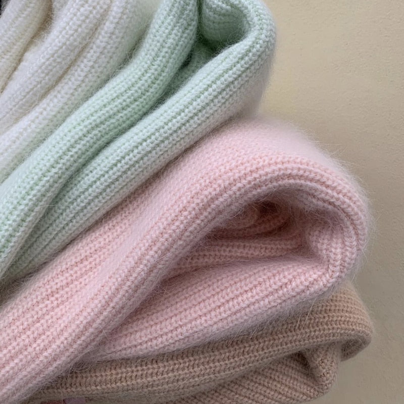 Cecile sweater folded: ribbed knit in mint, light pink, and soft beige