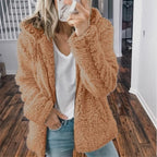 Light brown hooded teddy fleece vest with long sleeves and soft texture
