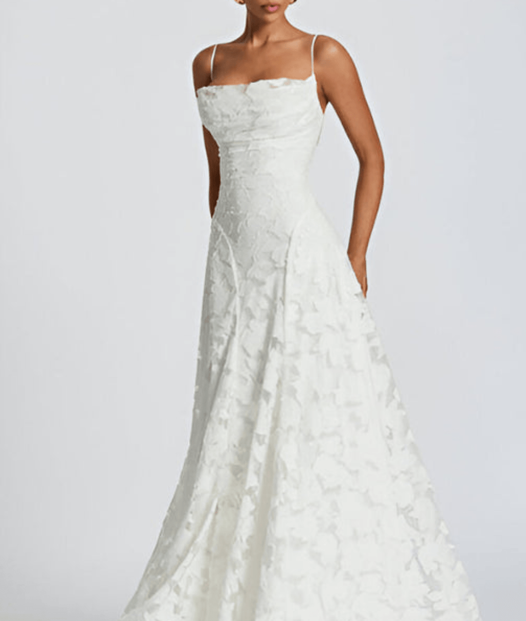 White spaghetti-strap maxi dress with textured fabric and fitted ruched bodice