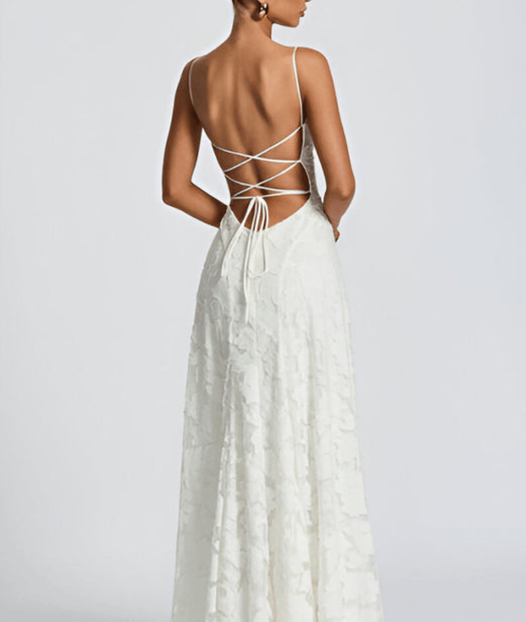 White maxi dress back with thin crisscross straps and open tied back