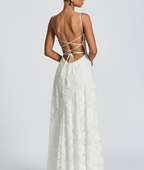 White maxi dress back with thin crisscross straps and open tied back