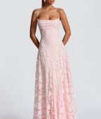 Pink spaghetti-strap maxi dress with textured fabric and fitted ruched bodice
