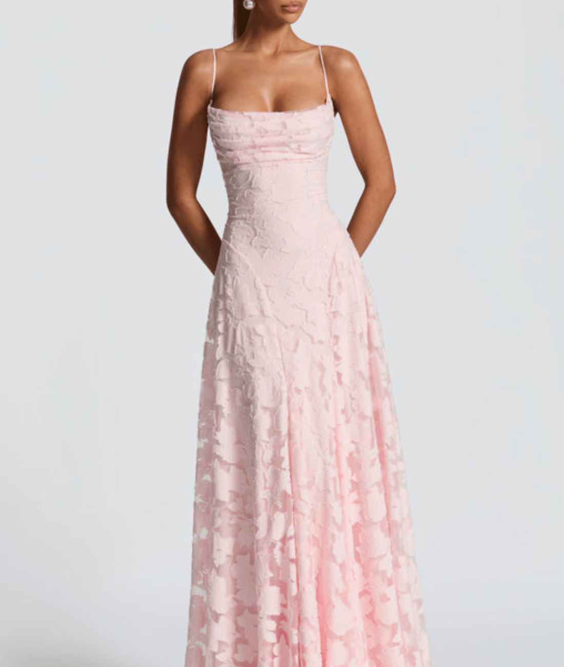 Pink spaghetti-strap maxi dress with textured fabric and fitted ruched bodice