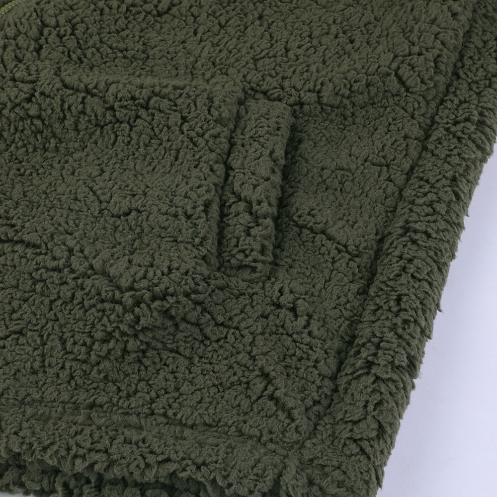 Olive green teddy fleece outerwear, textured sherpa fabric close-up