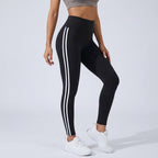 High-waisted black workout leggings with three white side stripe lines.