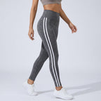 Women's high-waisted dark gray leggings with triple white side stripes
