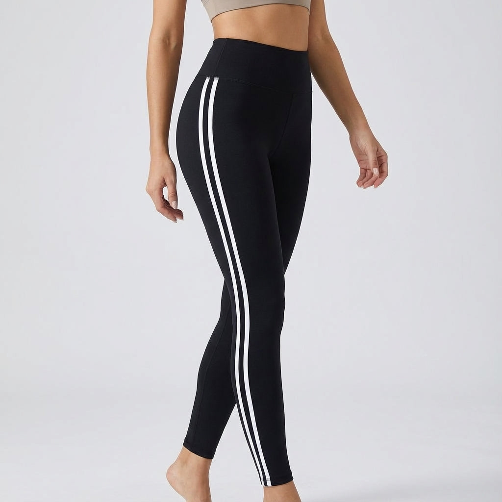 High-waisted black workout leggings with three white side stripe lines.