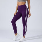 Women's high-waisted purple leggings with triple white side stripes