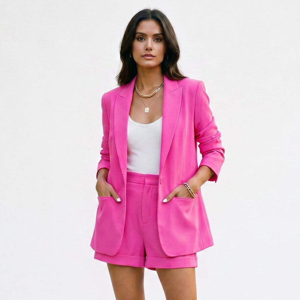 Pink blazer and matching shorts set with open front and tailored waist.