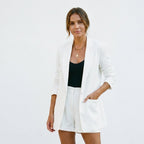 White blazer and matching shorts set with open front and structured, tailored shorts.