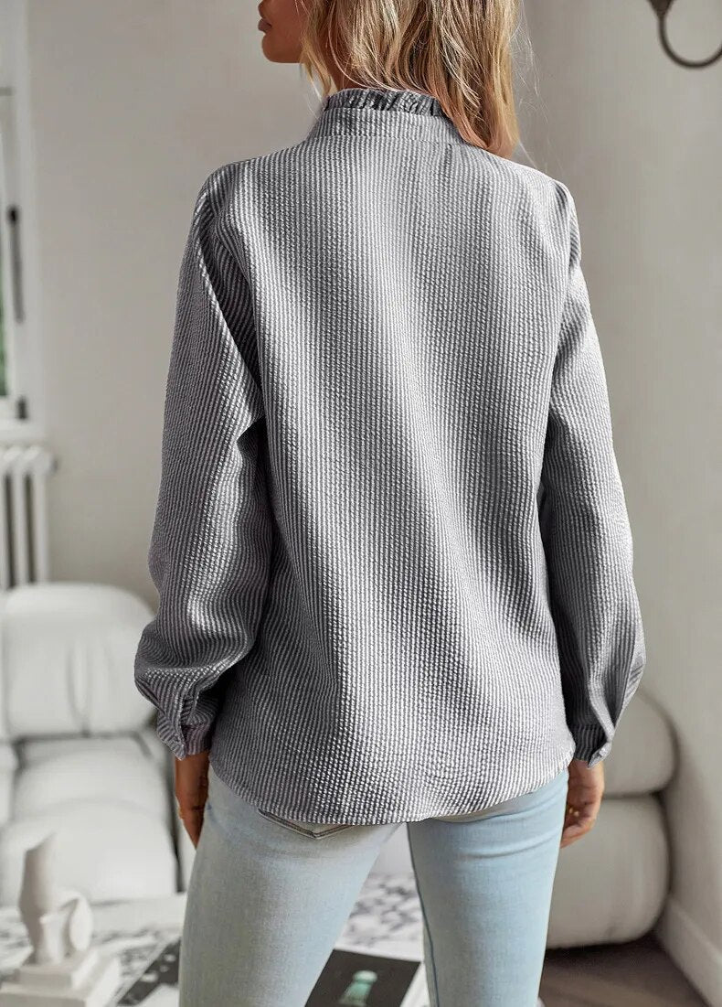 Gray long-sleeve ruffle button-up blouse, back view with button placket