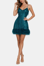 Teal-blue sequin party dress with feather fringe hem and narrow shoulder straps.