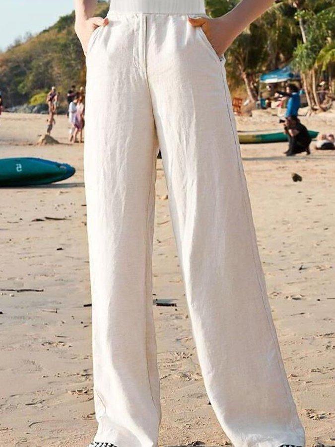 White high-waisted loose wide-leg pants with elastic waist and wide drape
