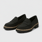 Black slip-on loafers with round toe and thick tread sole with light trim