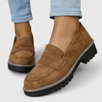 Brown slip-on loafers with round toe and double buckle strap detail