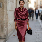 Burgundy satin cocktail midi dress with draped cowl neck, 3/4 sleeves and waist belt.