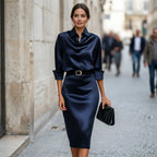 Navy satin cocktail midi dress with draped cowl neck, 3/4 sleeves and waist belt.